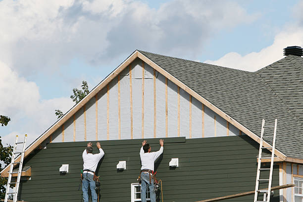 Professional Siding Contractor technician working in Hyde Park, MA